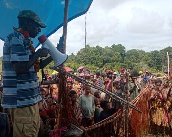 Local dignitaries hold speech at testlanding for Aiyu Airstrip