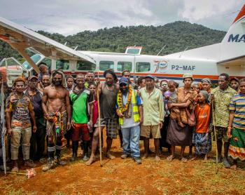 1Locals from Sikoi posed for a picture following MAF's successful test landing at the newly operational Sikoi airstrip.