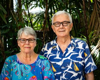 Retiree couple facing camera