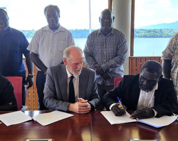 The Honourable President Ishmael Toroama is signing the MOU