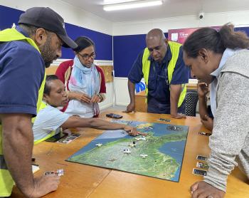 MAF staff playing the Mission Flight Board Game during a Training Session