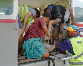 A week’s walk in 25 minutes: Medevac just in time for Phimi