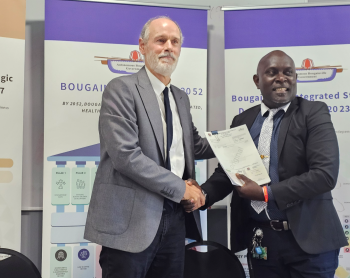 John Woodberry and Chief Secretary Mr. Nanei shaking hands