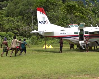 Kaiam Medevac patient being lifted unto MAF plane