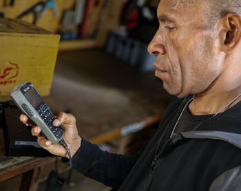 Isaac Yuma uses an HF radio to stay connected with his community, where mobile phone coverage is unavailable.