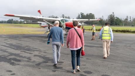 Hanno Allolio and Jutta Werdes walk to MAF plane.