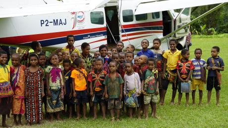 The Children in front of the MAF plane