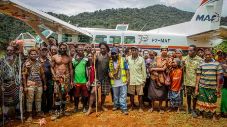 1Locals from Sikoi posed for a picture following MAF's successful test landing at the newly operational Sikoi airstrip.