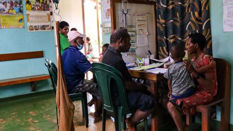 Health worker attending to a patient in the health centre