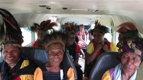 Women from Oksapmin travelling in a MAF plane to Baptist Conferece in Tabubil