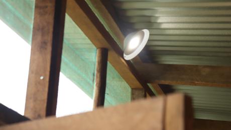 A waiting hut room lit by solar light from MAF Technologies.