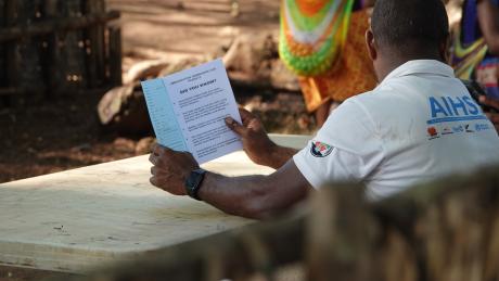Raising awareness: a health worker educates the Yambaitok community during the health patrol.