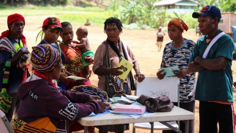Kompiam health worker Lucy Jack attends to patients during a health patrol in Yambaitok.