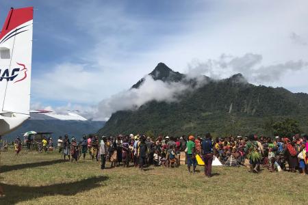 A huge crowd welcomes the first operational flight into Yalum