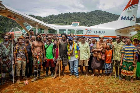1Locals from Sikoi posed for a picture following MAF's successful test landing at the newly operational Sikoi airstrip.