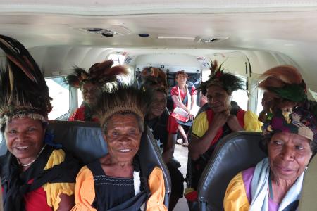 Women from Oksapmin travelling in a MAF plane to Baptist Conferece in Tabubil