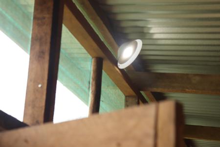 A waiting hut room lit by solar light from MAF Technologies.