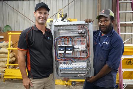Electricians work on upgrading the generator