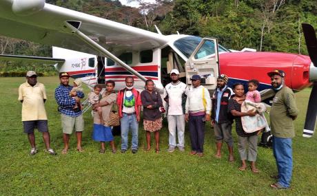 Yalumet health centre staff with the Etep team at Yalumet airstrip in front of the MAF aircraft P2-MAK on 10 July 2021
