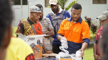 training session with village representatives on the Barefoot Solar home kit at the TCA base at Lumi