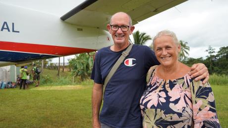 Ian and Sally Lloyd in front of a MAF plane at Mougulu