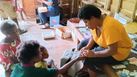 nurse performing a malaria test