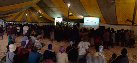 Mt Hagen Community Outreach Event_people in tent.