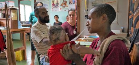 Mougulu clinic consultation - baby with scalp infection