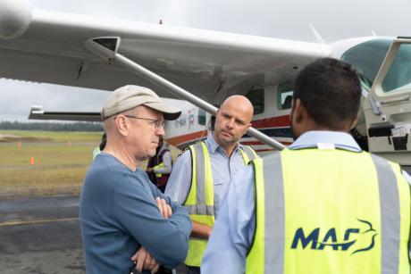 Hanno Allolio discusses the flight itinerary before departing MAF HQ.