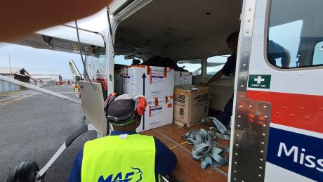 Port Moresby: pick up of vaccine boxes and safely strapped into our aircraft