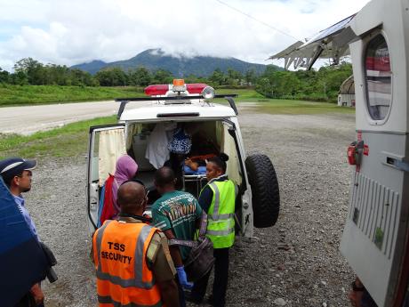 Osa being transferred from the plane to the ambulance