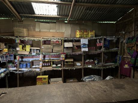 Inside a store, with shelves loaded with a few essentials