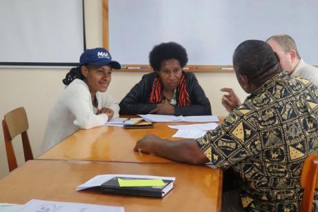 four MAF Technologies employees in a disscussion