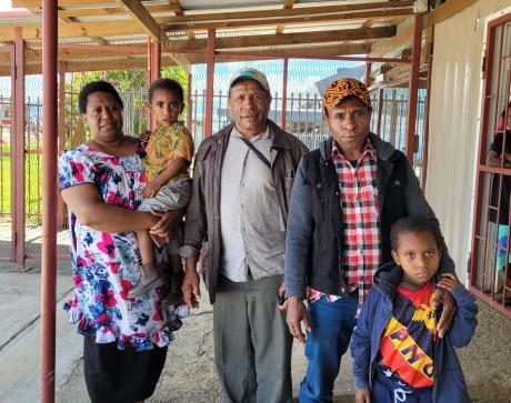 Yaoum Sani's family that was brought to Mt Hagen for her surgery, showing Yaoum (far right), her grandfather Sani Matayam (second from right), his sister Anna Mendai (far left), and her husband Sayer Mendai (second from left).