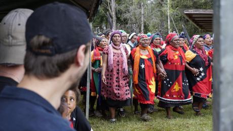 Ialibu Community singing traditional welcoming songs for the Co-pilot team