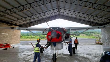 MAF aircraft pushed into the Wewak hangar