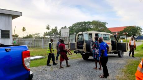 Transfer of the patient into the ambulance at Wewak MAF base