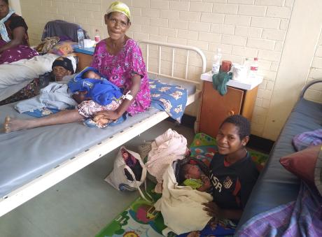 Two mothers from Mama Care Ministry with their newborn babies.