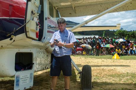 MAF PNG Pilot, Andy Symmonds Poses after unloading materials of Auwi airstrip.