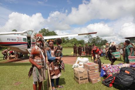 unloading supplies from the MAF plane on graduation day