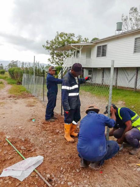 Facilities and Vehicles Team fixing the fence at the Telefomin base