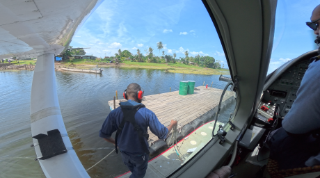 Titus Oaeke Fastening the float plane at docking station