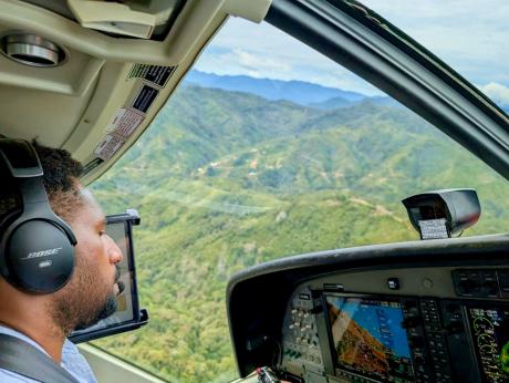 Ricky Poki flying MAF plane around Balimo