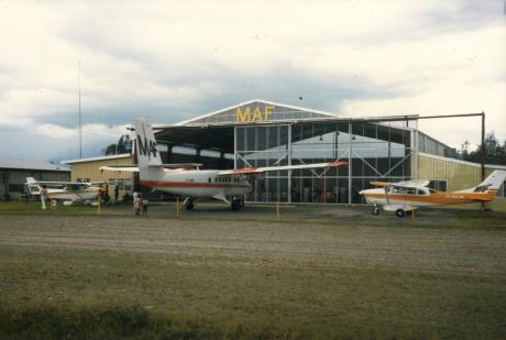 Aeroplanes in front of a hangar