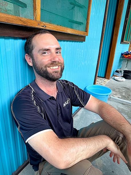 Karlos smiling and posing for the camera at Han Island during the installation of the HF radio and solar lighting system at the clinic.
