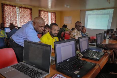 Johnson Irarue, MAF Tech BCT facilitator, assisting a participant during a BCT session.
