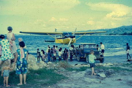 A floatplane is brought to shore by jeep