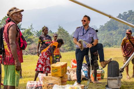 Pilot Timon and locals at Kaiam airstrip